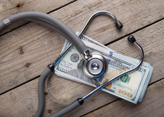 stethoscope over the money on the table